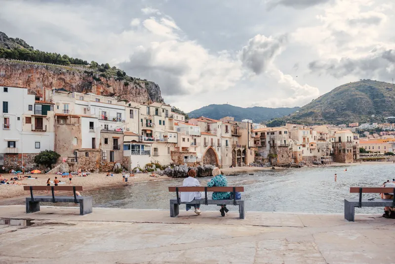 Cefalù's sandy Lungomare beach and seafront with the old town behind