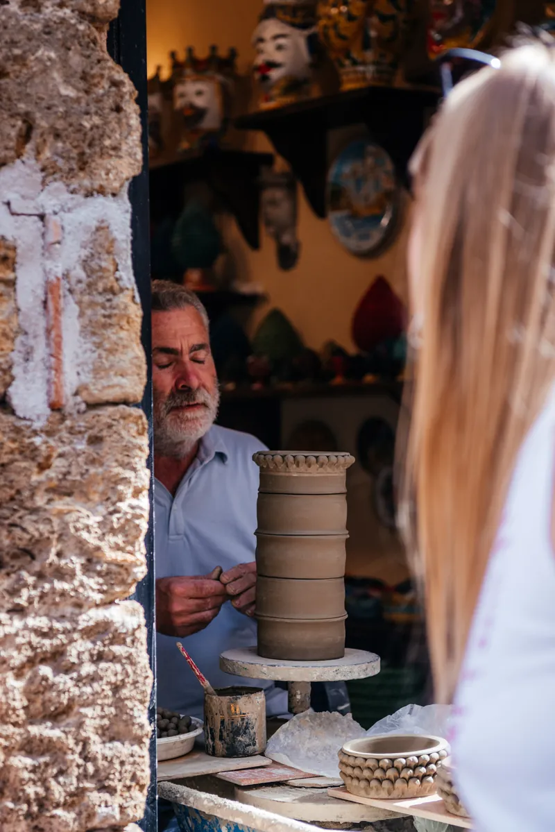A Sicilian ceramic artisan at work in a Cefalù workshop