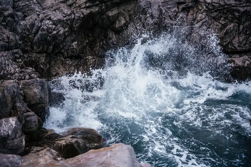 Waves breaking on the rocky shore below Cefalù